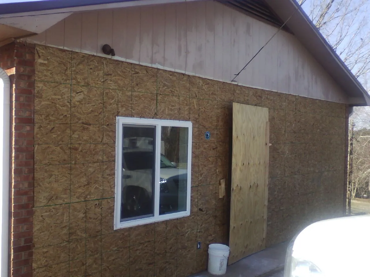 OSB sheathing on a garage addition wall before siding in West Richland